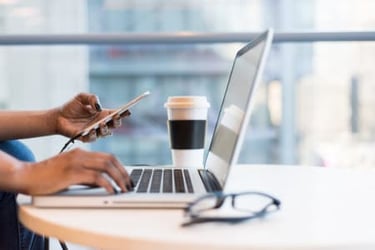 laptop and coffee on table